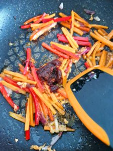 Stir carrot and paprika