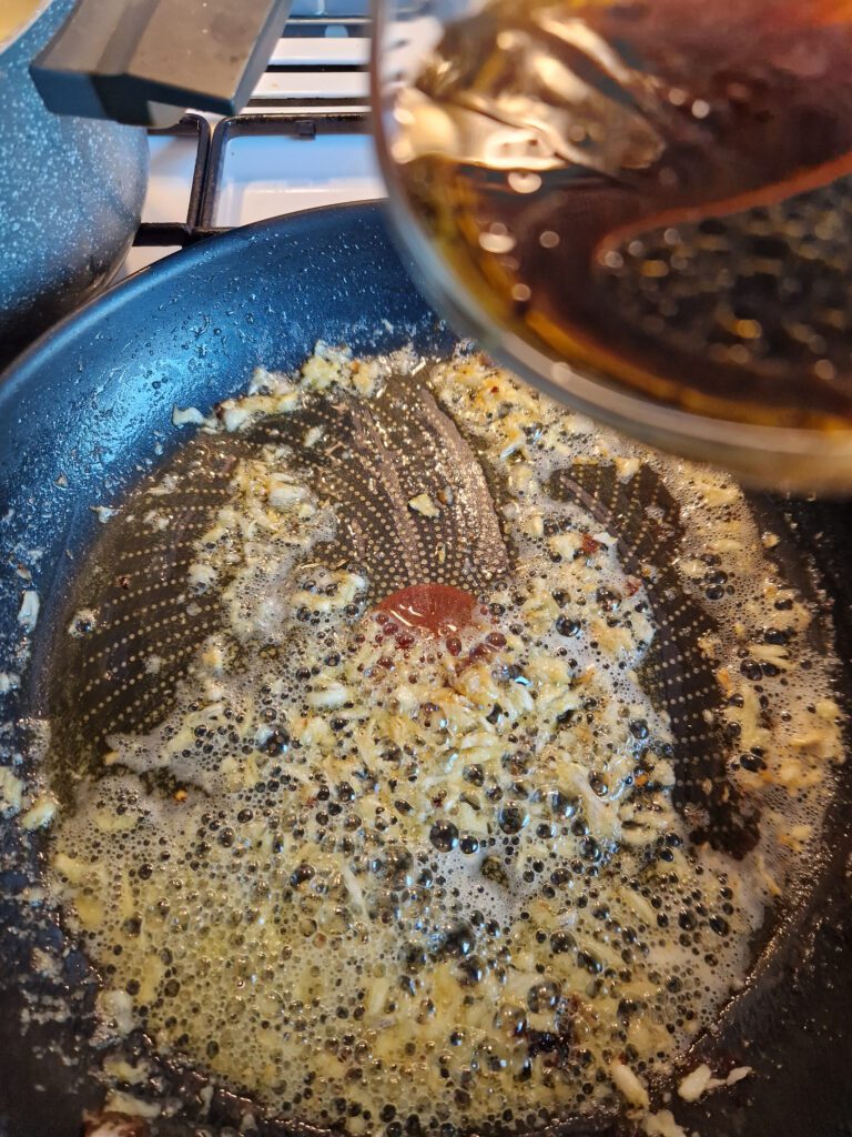 stirring garlic and add the sauce