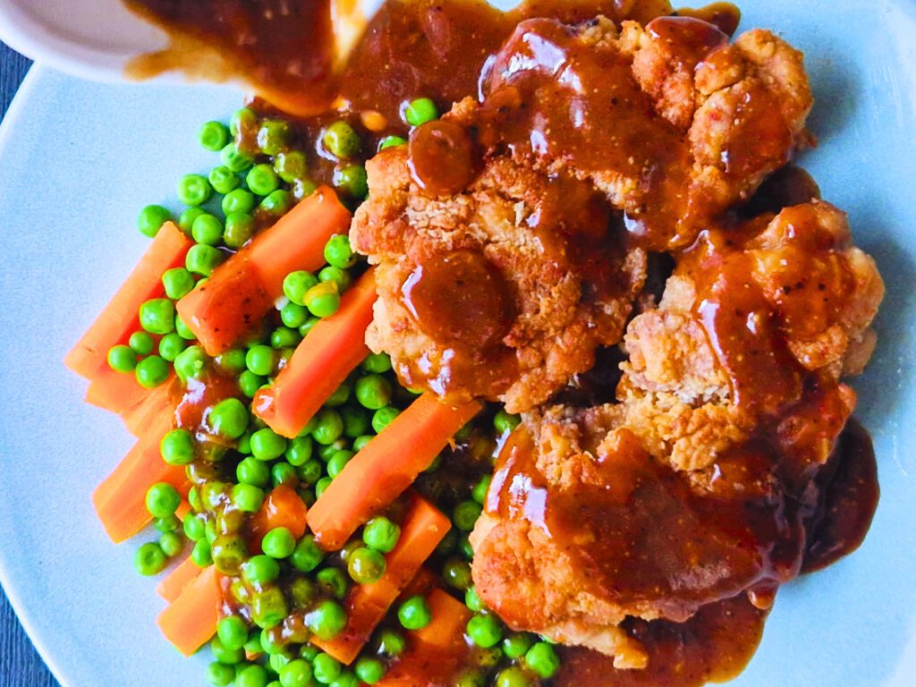 Serve the chicken chop and drizzle it with that nice pepper sauce
