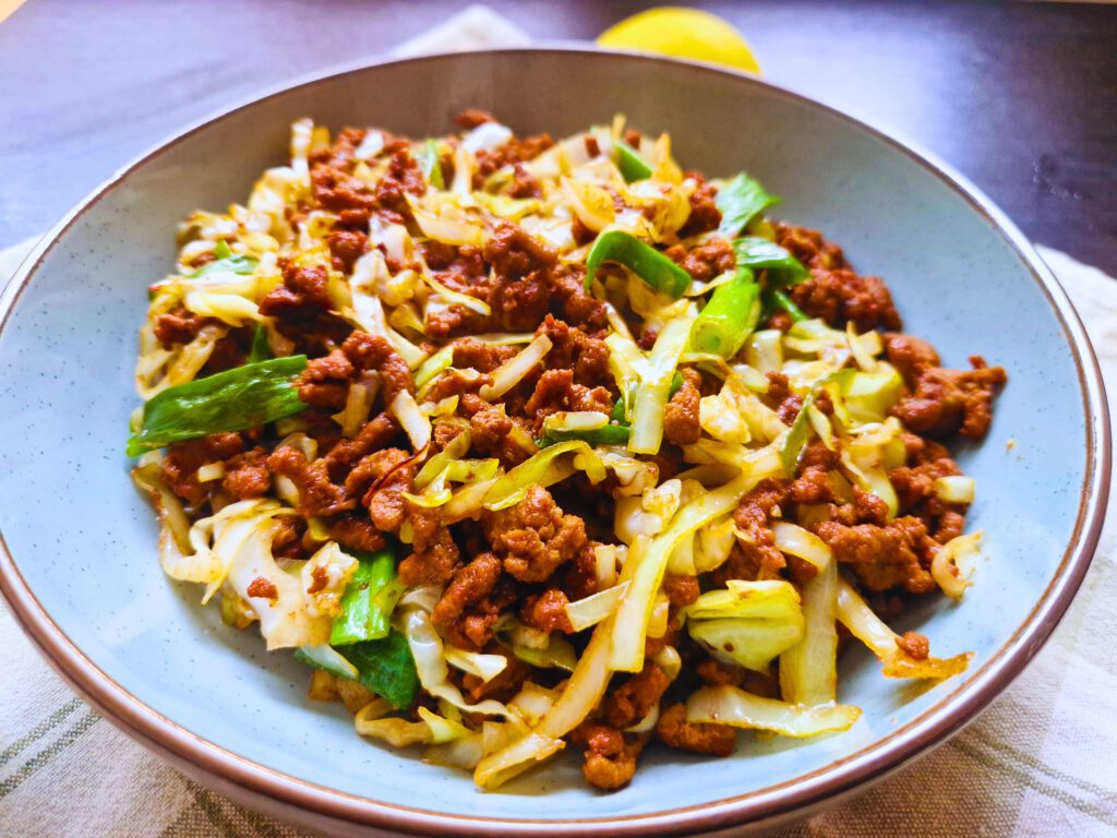 Serve beef and cabbage stir fry with steamed rice