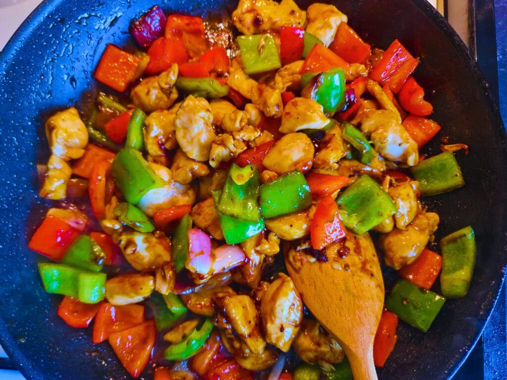 Put the chicken back into the wok, add the sauce, and stir well for about a minute.